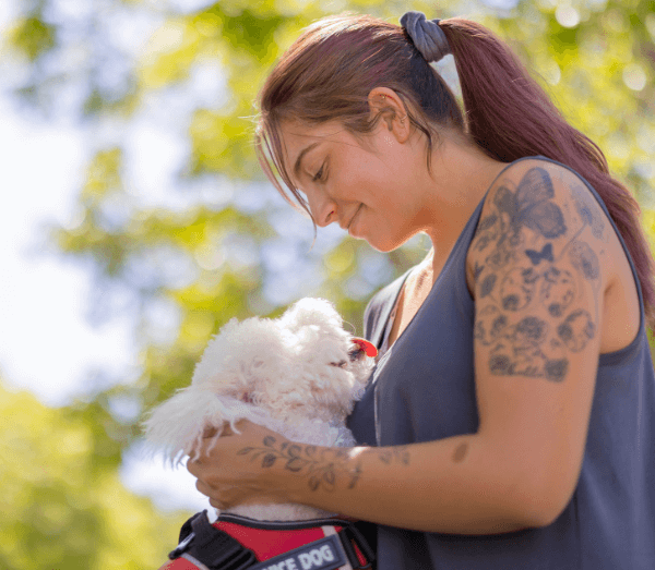 A woman and her service dog, soon to be admitted to addiction rehab therapy