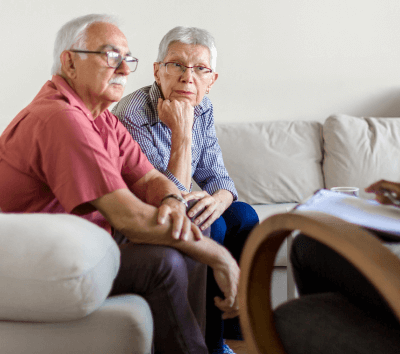 Senior couple discussing individual and family addiction counseling