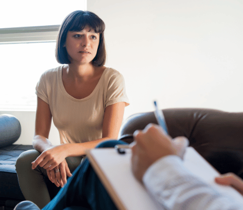 A woman taking an addiction assessment and getting information on medication for detox